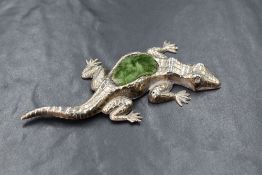 An Edwardian silver novelty pin cushion, modelled as a lizard having green fabric to the body, marks
