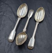 A group of three Victorian silver fiddle and thread pattern spoons, having heraldic crests and