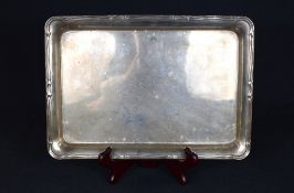 An early George V silver tray, of rectangular form having a moulded scroll rim, marks for Birmingham