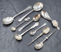 An assortment of silver and white metal spoons, including replica Coronation spoons and spoons