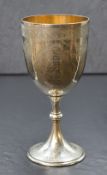 A Victorian silver presentation goblet, of traditional form having gilt interior with decorative