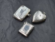 A Victorian silver vesta case, in a heart form having floral engraving and 'CE' initials, marks