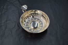 An Italian white metal 800. grade taste de vin, of circular form having a rounded rim with raised