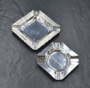 An Elizabeth II silver ashtray, of square form having four cigarette holders and engine turned