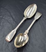 A pair of Victorian silver fiddle and thread pattern serving spoons, having rubbed monograms to