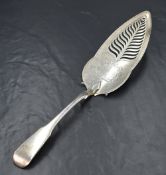 A George III silver fiddle pattern fish slice, having pierced decoration and floral engraving, marks