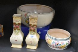 A Poole pottery bowl decorated with floral designs, impressed pattern no '567' to base, w14cm,