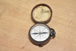 A 19th Century pocket compass in leather case, diameter approx. 5cm