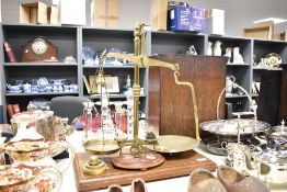 A large 'Avery' scale on wooden base with weights, h50cm, sold together with a miniature weighing