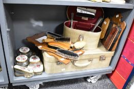 A vintage ladies vanity/grooming set, (6), sol d together with a travel trunk, vintage shoe