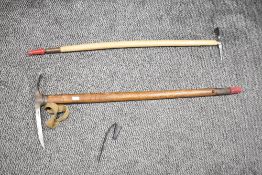 A 20th century ice axe having impressed mark for 'Weismies' & 'G & Co', L84cm, sold alongside 1