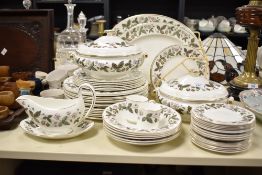 A Wedgwood Bone China 'Strawberry' pattern dinner service, to include tureens, ashets, sauce boat