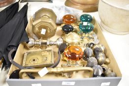 A solid brass octagonal door knob, L10.5cm, sold together with a pair of green glass door knobs