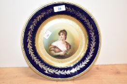 A German Rosenthal porcelain plate, the centre having a hand painted portrait of a young female