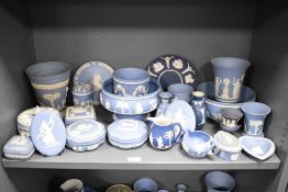 A group of Wedgwood Jasper ware decorated with classical motifs on a blue ground, to include vase,
