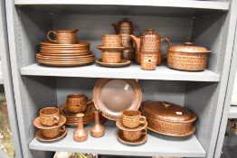 A vintage Wedgwood Pennine dinner service having geometrical patterns on a brown ground, to