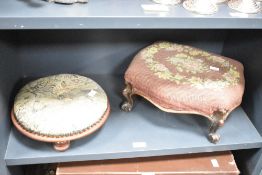 A Victorian foot stool having floral decoration and raised on scroll legs, w30cm, sold together with