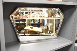 An early 20th century mirror having bevelled edges, L67.5cm