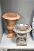 Two traditional cast iron campagna style garden urns of small proportions, height approx. 34 & 25cm