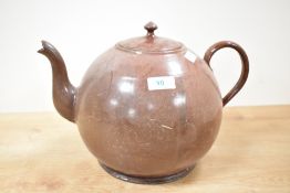 A brown enable tea pot of circular form having shaped spout and handle, h23cm