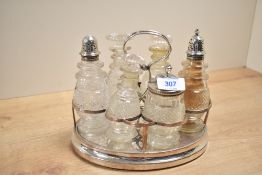 A 20th century condiment set, to include mustard pot, shakers ect