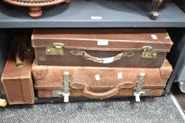 A group of 3 travel trunks, largest w57cm