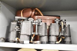 A pair of binoculars having 10 x 50 zoom and compass, h18cm, sold together with 3 others, (4)