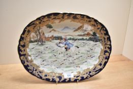 A Chinese export plate decorated with landscape hunting scene featuring a horseman within a yellow