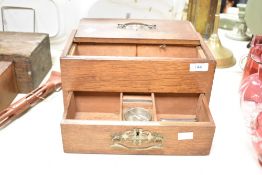 An early 20th century oak cigar box, w31cm x h16cm