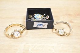 A small collection of costume jewellery, including wristwatches, brooches and clip-on earrings