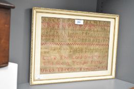 A mid 19th century tapestry / needlework having alphabet and reading 'Love The Lord And He Will