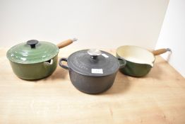 A green cast iron Le Creuset saucepan with cover, w20cm, sold together with two other Le Creuset
