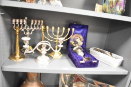 A pair of heavy bronze/ metal candlesticks, h19.5cm, sold together with a silver plated candelabra