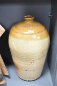 A large stoneware flagon having impressed marks for 'Rowland Atkinson Wine & Spirit Merchant