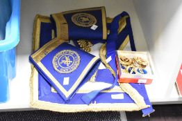 A Cumberland Westmorland Masonic Regalia with cuffs and 7 badges