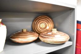 A set of three 19th century copper water bottles, w27cm