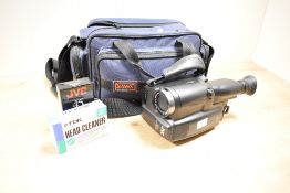 A JVC GR-AX210 compact UHS video camera with instruction manual, to include bagect, (4)