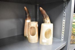 A pair of viking style drinking horns with stands, h27cm