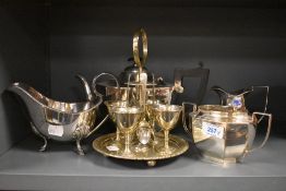 A silver plated 4 piece egg cruet set with spoons, h21cm, sold together with a silver plated sugar