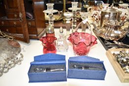 A pair of glass candlesticks having bobbin style body and circular base, h24cm, sold together with a