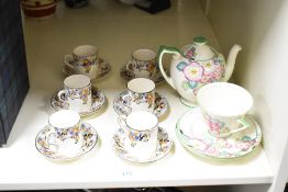 A Royal Doulton 'Pink Plaza' tea pot decorated with floral designs having shaped spout and handle,