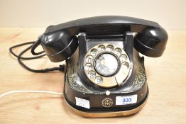 A vintage rotary bell telephone, h13cm