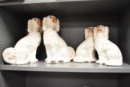 A pair of 19th century Staffordshire dogs, h32cm, sold together with a similar pair, (4)