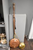 A 19th century copper and brass bed warmer having turned wooden handle, L107cm, sold together with a