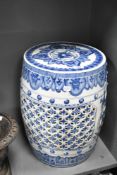 A reproduction Chinese blue and white porcelain garden seat of barrel shape, height approx. 46cm