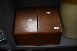 An early 20th century wooden stationary cabinet having base drawer, w38.5cm