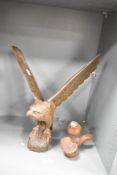 A carved wooden eagle sculpture, h38cm, sold together with a wooden sparrow, (2)