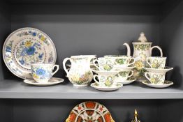 A Mason's ironstone 'Strathmore' pattern dinner service, decorated with floral patterns on a cream