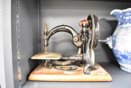 A Victorian Willcoxs & Gibbs sewing machine, h27cm