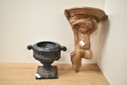 A cast black metal urn of classical form, having scroll handles and square base, h17cm, sold